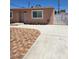 This home has a brick-patterned driveway with adjacent concrete and secure gated access at 1972 H St, Las Vegas, NV 89106