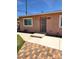 Charming single-story home with a secure front door and well-maintained walkway at 1972 H St, Las Vegas, NV 89106