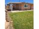 Charming single-story home with a well-maintained front yard and covered parking area at 1972 H St, Las Vegas, NV 89106