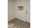 Room featuring wood-style flooring, an air conditioner, and neutral-toned walls at 1972 H St, Las Vegas, NV 89106