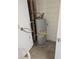Hot water heater with connections visible inside the laundry room at 1972 H St, Las Vegas, NV 89106