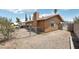 View of backyard with chain link fence, dirt and view of home's exterior at 204 Breeze St, Las Vegas, NV 89145