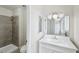 Bathroom featuring a tiled shower, modern vanity, and neutral color scheme at 204 Breeze St, Las Vegas, NV 89145