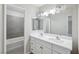 This bathroom has a double vanity sink and a shower at 204 Breeze St, Las Vegas, NV 89145