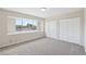 Spacious bedroom featuring a large window, new paint, and ample closet space at 204 Breeze St, Las Vegas, NV 89145