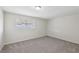Bedroom with neutral walls, carpeted flooring and a horizontal window at 204 Breeze St, Las Vegas, NV 89145