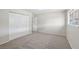 This carpeted bedroom has a large closet and a window for natural light at 204 Breeze St, Las Vegas, NV 89145