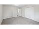 This bedroom has neutral walls and carpeted floors, with a closet and doorway visible at 204 Breeze St, Las Vegas, NV 89145