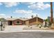 Charming single-story home with a well-maintained front yard and mature landscaping at 204 Breeze St, Las Vegas, NV 89145