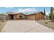 Charming single-story home with a desert-landscaped front yard and long driveway at 204 Breeze St, Las Vegas, NV 89145