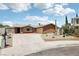 Charming single-story home with a desert-landscaped front yard and long driveway at 204 Breeze St, Las Vegas, NV 89145