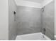 This bathroom features a tiled shower with a built-in shelf at 204 Breeze St, Las Vegas, NV 89145
