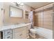 Bright bathroom with a white vanity, decorative backsplash, and shower over tub combination at 2486 Sabado St, Las Vegas, NV 89121