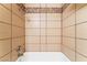 Close up view of tub shower featuring neutral colored tiles with decorative tile border at 2486 Sabado St, Las Vegas, NV 89121
