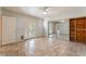 Bright bedroom featuring tiled flooring, sliding mirrored closet, and backyard access at 2486 Sabado St, Las Vegas, NV 89121