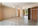 Spacious bedroom features a ceiling fan, tiled floor, and large closet with mirrored doors at 2486 Sabado St, Las Vegas, NV 89121