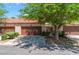 Charming townhome featuring a private garage, quaint landscaping and a terra cotta tiled roof at 2486 Sabado St, Las Vegas, NV 89121