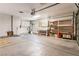 Spacious garage featuring storage cabinets, overhead lighting, and visible utilities at 2486 Sabado St, Las Vegas, NV 89121