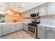 Well-lit kitchen with stainless appliances, tile backsplash, and ample countertop space at 2486 Sabado St, Las Vegas, NV 89121
