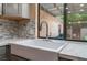 Close-up of a kitchen sink with modern fixtures and a view of the backyard at 2486 Sabado St, Las Vegas, NV 89121