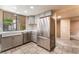 Updated kitchen with stainless steel appliances and a large window overlooking the backyard at 2486 Sabado St, Las Vegas, NV 89121