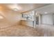 Open-concept living space with tile floors adjacent to the kitchen with stainless appliances at 2486 Sabado St, Las Vegas, NV 89121