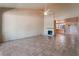 Bright living room with tile flooring, fireplace, and ceiling fan for a cozy and inviting atmosphere at 2486 Sabado St, Las Vegas, NV 89121