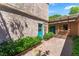 Enclosed back patio featuring mature landscaping, a covered trellis, and lots of natural light at 2486 Sabado St, Las Vegas, NV 89121