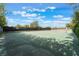 Community tennis court surrounded by lush greenery at 2486 Sabado St, Las Vegas, NV 89121