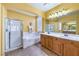 Bright bathroom with a glass shower, soaking tub, and double vanity with ample counter space at 2561 Pyramid Pines Dr, Henderson, NV 89052