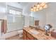 Elegant bathroom featuring granite countertop, walk-in shower, and ample vanity storage for everyday needs at 2561 Pyramid Pines Dr, Henderson, NV 89052