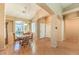Cozy dining room with wood floors, a large window, and traditional furniture at 2561 Pyramid Pines Dr, Henderson, NV 89052