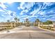 Community entrance showcasing elegant signage and palm trees, marking the entry to a desirable residential area at 2561 Pyramid Pines Dr, Henderson, NV 89052