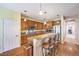 Inviting kitchen with a breakfast bar, wooden cabinetry, and stainless steel appliances at 2561 Pyramid Pines Dr, Henderson, NV 89052