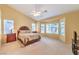 Large main bedroom featuring vaulted ceilings, neutral walls, and a bay window with natural light at 2561 Pyramid Pines Dr, Henderson, NV 89052