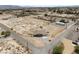 Aerial view of a single-story home on large desert lot with two-car garage and rural setting at 2571 N David St, Pahrump, NV 89060
