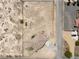 Overhead view of home on a large, fenced desert lot with utility buildings and desert landscape at 2571 N David St, Pahrump, NV 89060