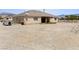 Spacious backyard with gravel landscaping, offering potential for customization and outdoor activities at 2571 N David St, Pahrump, NV 89060