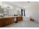 Spacious bathroom features double vanity, large bathtub, and neutral tiling, creating a serene atmosphere at 2571 N David St, Pahrump, NV 89060