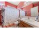 Functional bathroom featuring a shower-tub combo and tiled sink at 2571 N David St, Pahrump, NV 89060