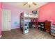 Cozy bedroom with loft bed, ample space, and laminate floors at 2571 N David St, Pahrump, NV 89060