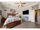 Cozy bedroom with wood flooring, a ceiling fan, and ample natural light, perfect for relaxation and comfort at 2571 N David St, Pahrump, NV 89060