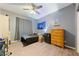 Bedroom with ceiling fan, natural light, and ample space for a bed and furniture at 2571 N David St, Pahrump, NV 89060