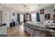 Bright bedroom with wood floors, ceiling fan, and plenty of natural light, creating a comfortable retreat at 2571 N David St, Pahrump, NV 89060