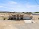 Single-story desert home with covered entry, 2-car garage, and a spacious, level lot at 2571 N David St, Pahrump, NV 89060