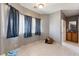Bright room featuring tile floors, ample natural light, and neutral walls, providing a versatile living space at 2571 N David St, Pahrump, NV 89060