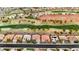 Aerial view showcasing a golf course community with lush green fairways, mature trees, and well-maintained houses at 2621 Spalding Dr, Las Vegas, NV 89134
