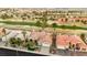 Aerial view features beautiful homes in a golf community with mature trees and green fairways at 2621 Spalding Dr, Las Vegas, NV 89134