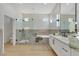 Luxurious bathroom with a glass shower, soaking tub, and double vanity with modern fixtures at 2621 Spalding Dr, Las Vegas, NV 89134