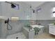Bathroom with a glass shower, soaking tub with a built in caddy, and neutral-toned decor at 2621 Spalding Dr, Las Vegas, NV 89134